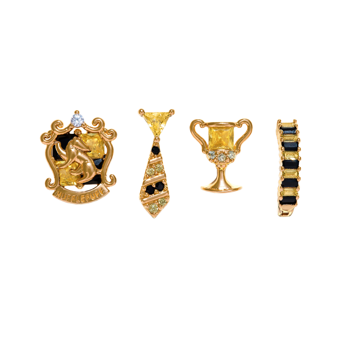 Set of gold and black Hufflepuff jewelry pieces on a white background