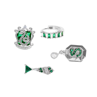 Set of silver Slytherin jewelry with green gemstones on a white background
