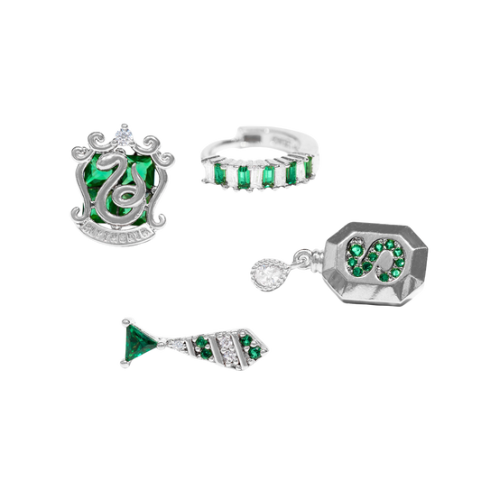 Set of silver Slytherin jewelry with green gemstones on a white background