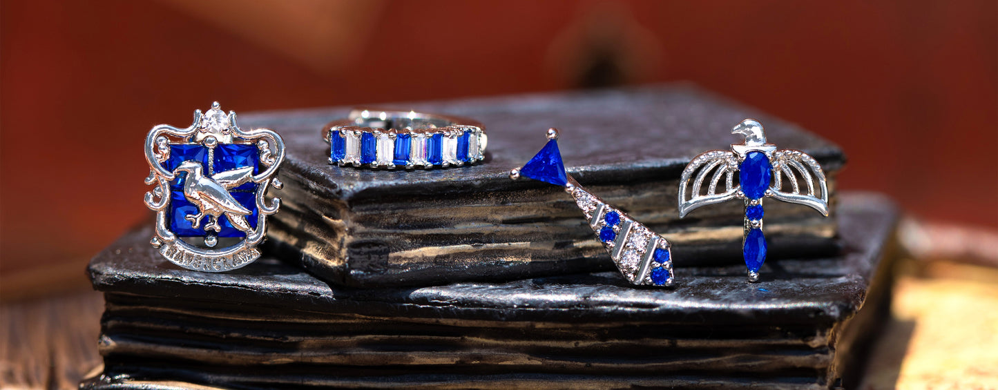 Ravenclaw jewelry set with blue and silver elements on a dark surface