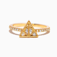 Gold ring with a triangular design and small diamonds on a white background