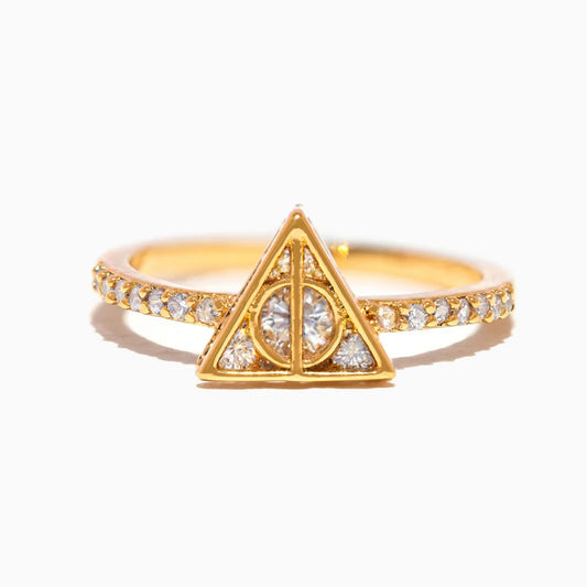 Gold ring with a triangular design and small diamonds on a white background
