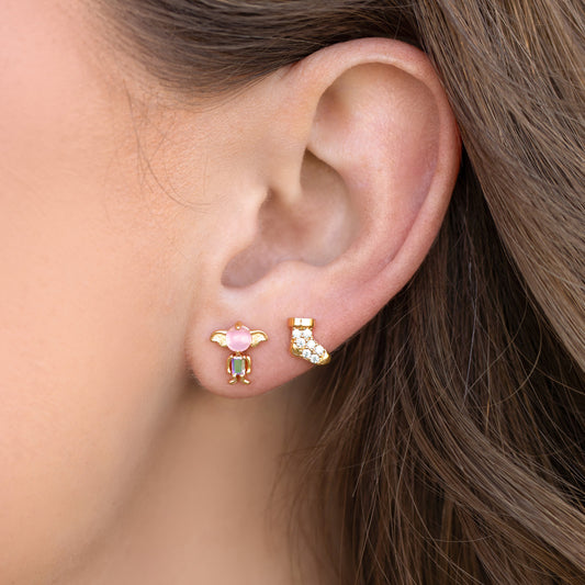 Close-up of an ear wearing colorful Dobby stud earrings