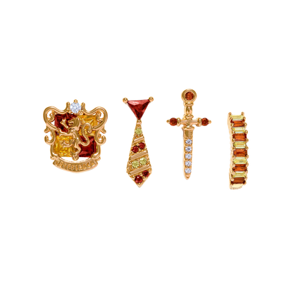 Set of gold and gemstone Gryffindor jewelry pieces on a white background