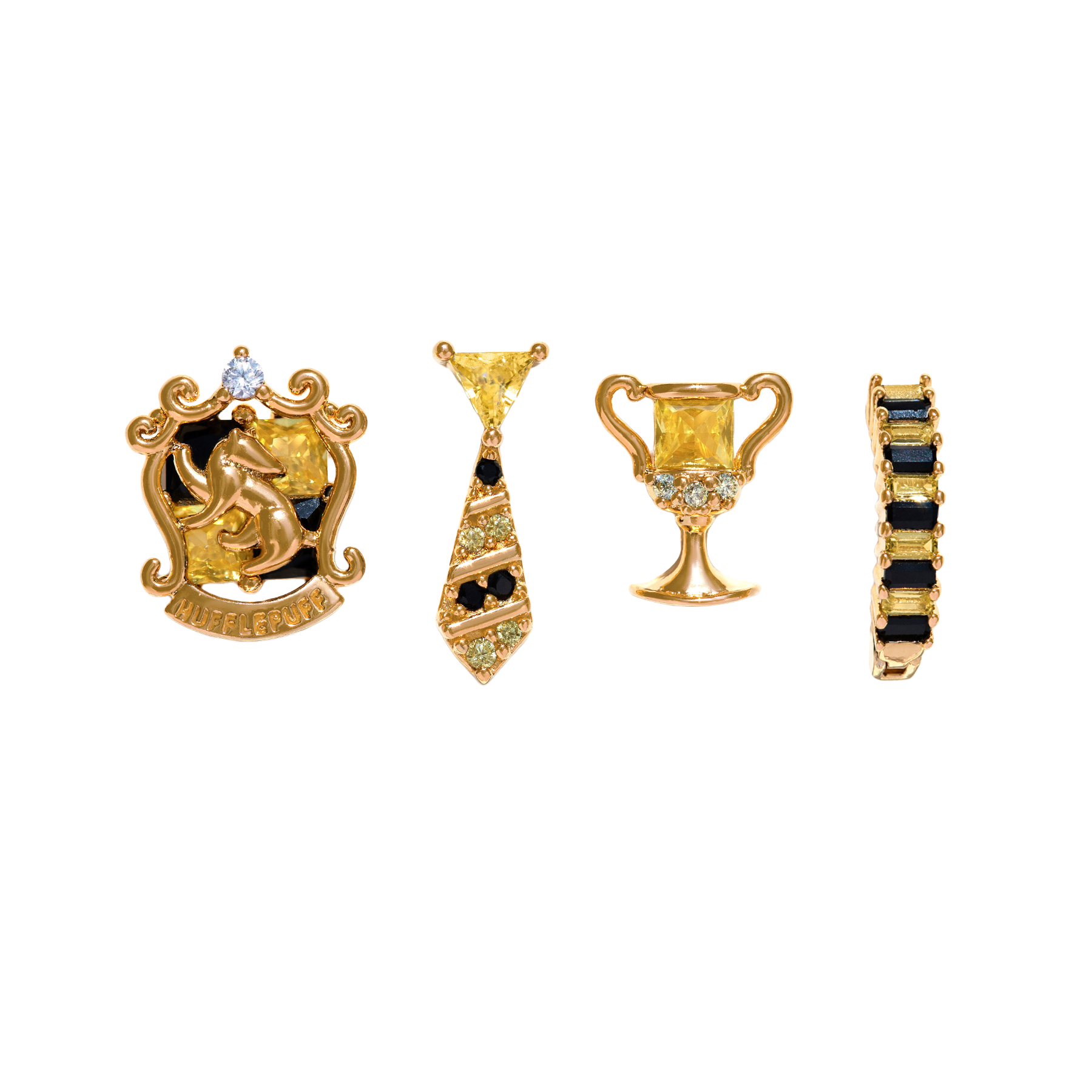 Set of gold and black Hufflepuff jewelry pieces on a white background