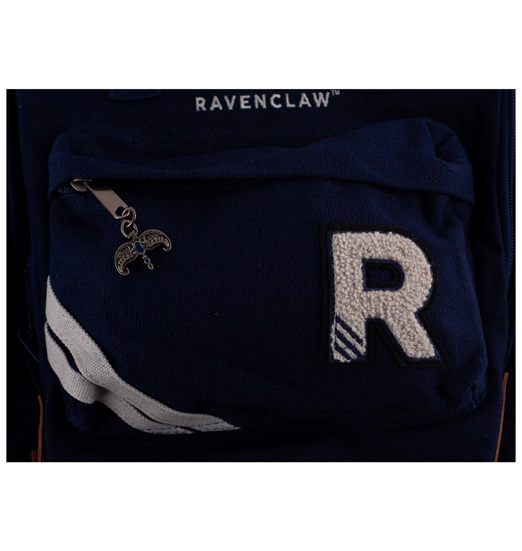 Navy blue bag with 'R' emblem and 'Ravenclaw' text on a white background