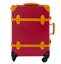 A red and yellow Gryffindor travel case with gold-plated clasps and canary yellow handles, featuring the Gryffindor house crest on the front.