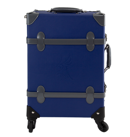 A navy blue Ravenclaw travel case with grey handles and straps, featuring silver-plated clasps and four rotating wheels.